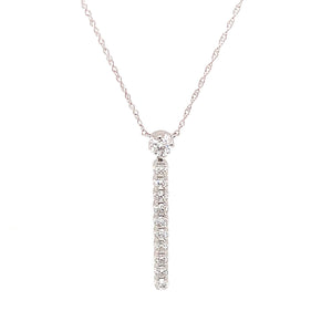 A 14k white gold necklace with a stick pendant featuring 11 round b...
