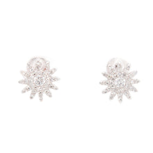 These unique and modern earrings feature diamonds totaling 0.42ct