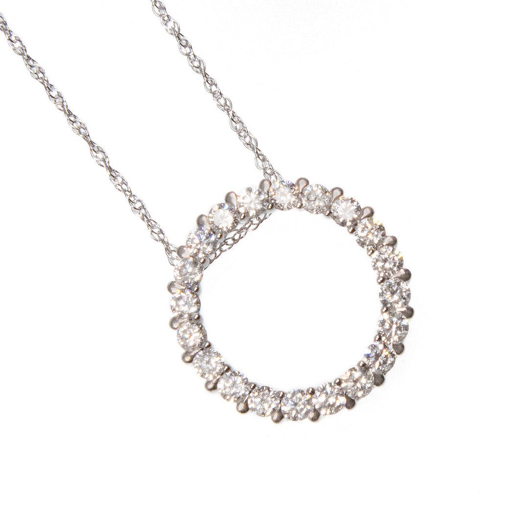 This elegant necklace features a circle pendant with diamonds total...