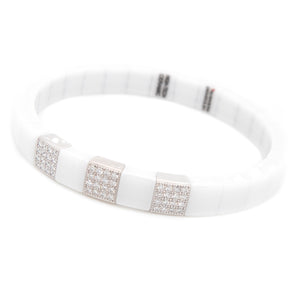 This bracelet features diamonds with an 18k white gold finish and w...