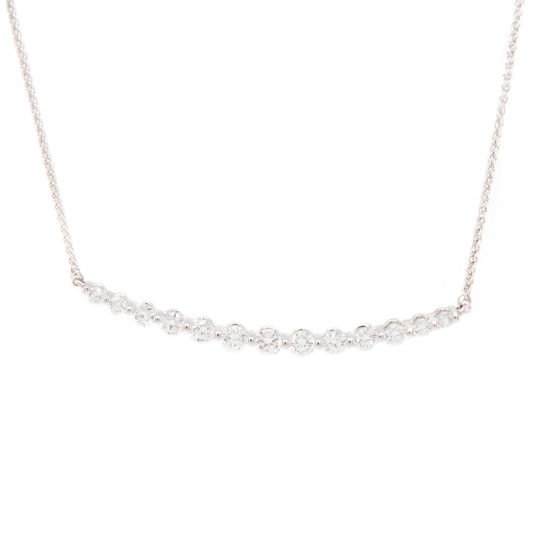 This necklace features 13 round brilliant cut diamonds totaling .56ct