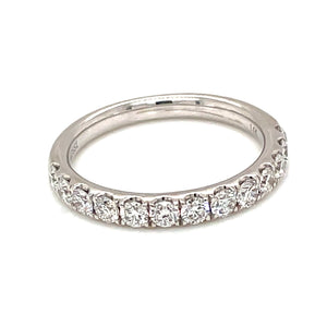 This classic 14k white gold band features 13 round brilliant cut di...