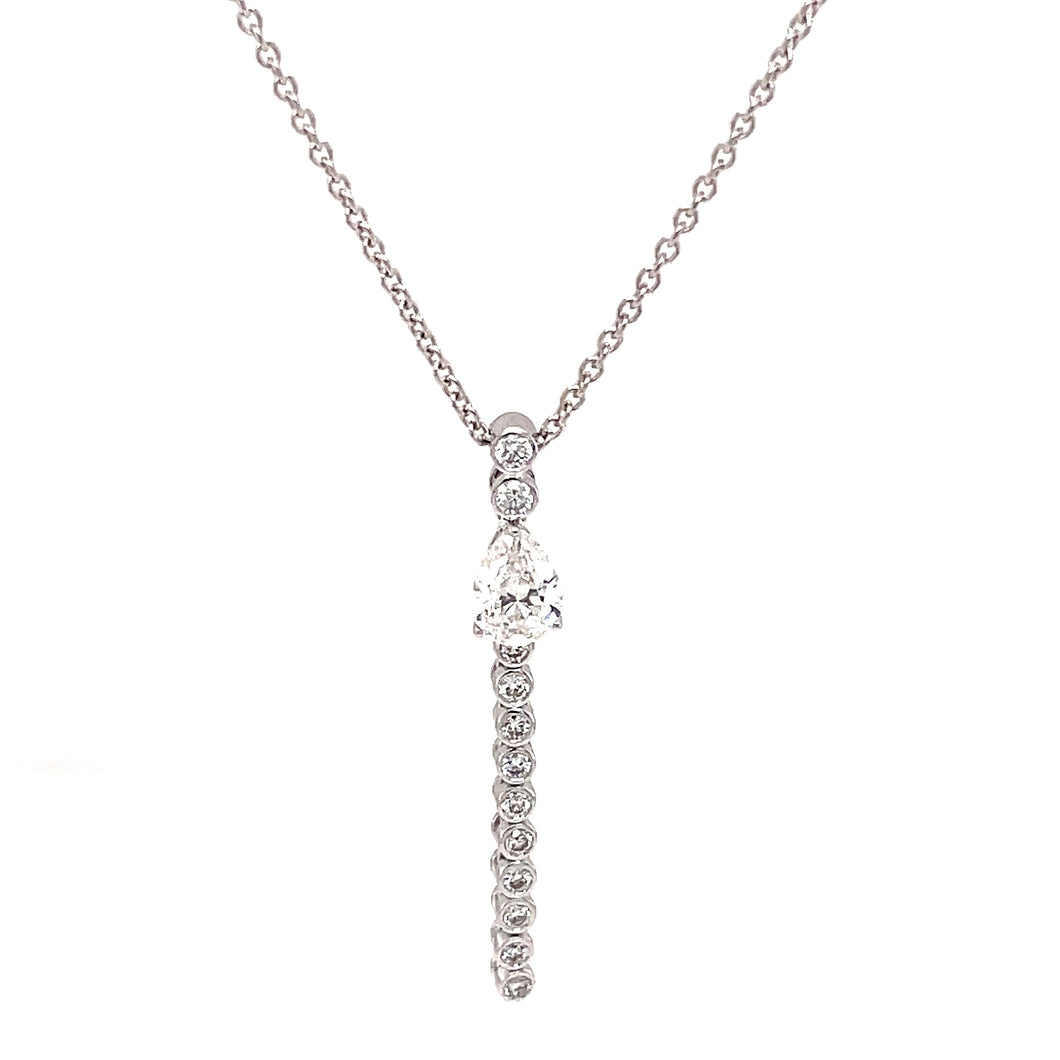 This necklace features a pear shape diamond and round brilliant cut...