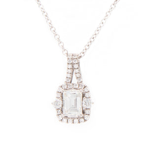 This pendant features an emerald cut diamond in the center totaling...