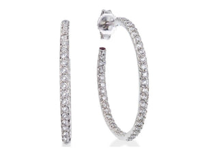 These diamond hoop earrings from Roberto Coin feature round brillia...