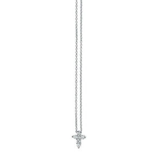 This diamond cross features round brilliant cut diamonds that total...