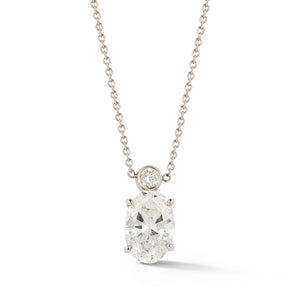 This diamond pendant features an oval cut diamond that is a K/SI 1....
