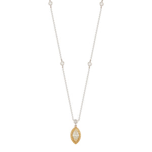 This diamond pendant features a 1.55ct marquise diamond in the cent...