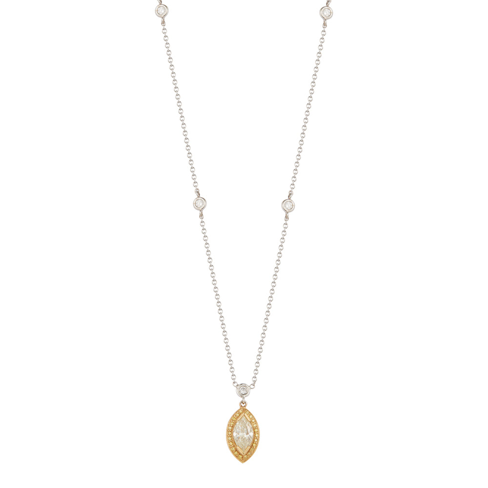 This diamond pendant features a 1.55ct marquise diamond in the cent...