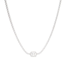 This elegant 18k white gold necklace features baguette and round br...