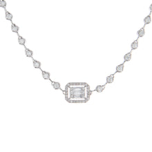 This necklace features round cut and baguette cut diamonds totaling...
