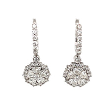 These unique drop earrings feature 10 heart shape diamonds totaling...