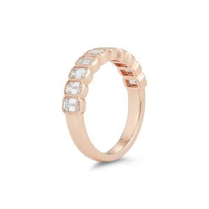 This 14k rose gold band features emerald cut diamonds that totals 1...
