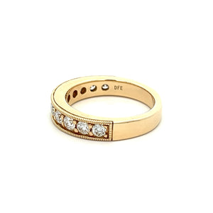 This beautiful 14k yellow gold diamond band features 11 channel set...