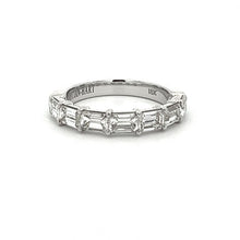 This gorgeous 18k white gold ring features 7 baguette cut diamonds ...