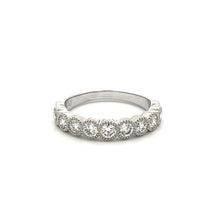 This stackable diamond band features 9 bezel set diamonds totaling ...