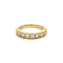 This stackable diamond band features 9 bezel set diamonds totaling ...