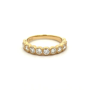 This stackable diamond band features 9 bezel set diamonds totaling ...