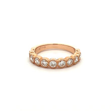 This stackable diamond band features 9 bezel set diamonds totaling ...