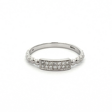 This 14k white gold ring features round brilliant cut diamonds on a...