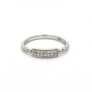 This 14k white gold ring features round brilliant cut diamonds on a...