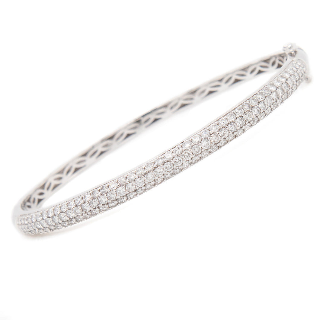 This bangle features 3 rows of pave-set diamonds. 127 diamonds are ...