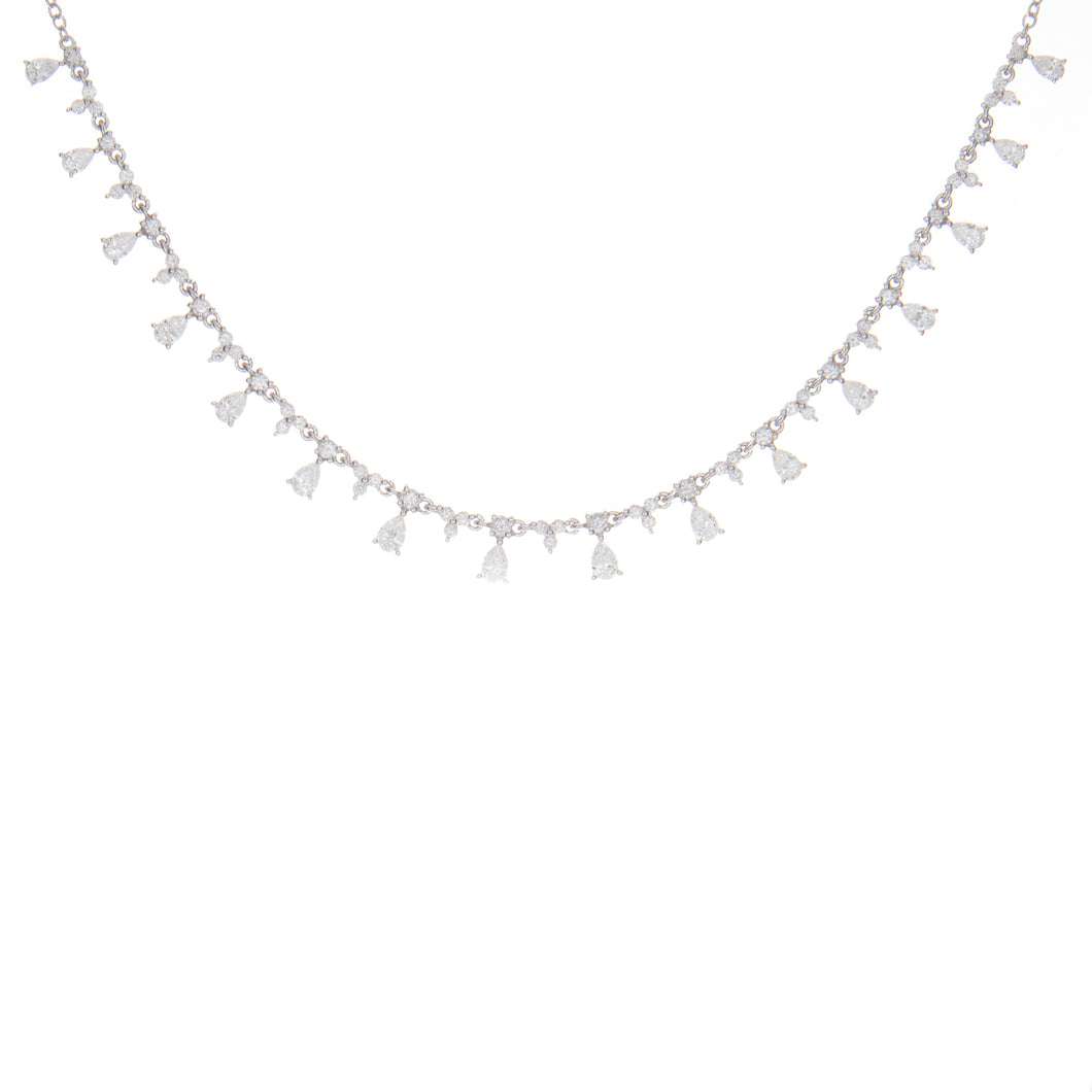 this necklace features round brilliant cut and pear shape diamonds ...