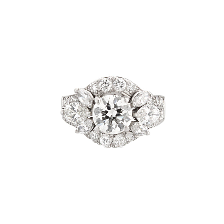 This ring features marquise and round brilliant cut diamonds with a...