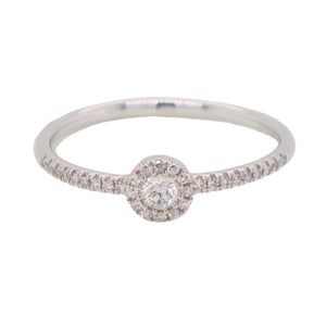 This modern and delicate ring features round cut diamonds that tota...