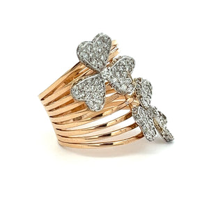 This 14k rose gold flower ring features pave-set round brilliant cu...
