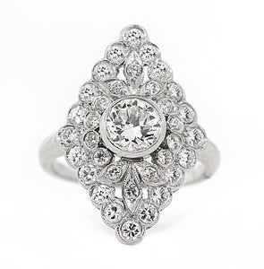 This stunning platinum estate ring features a .80ct round brilliant...