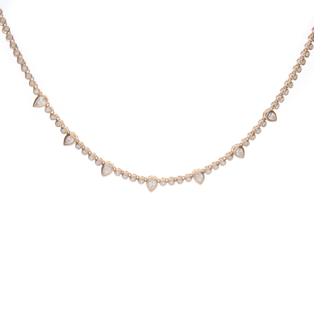 this tennis style necklace features round brilliant cut diamonds an...