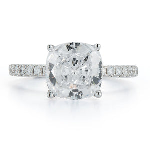 This 18k white gold diamond engagement ring setting features round ...