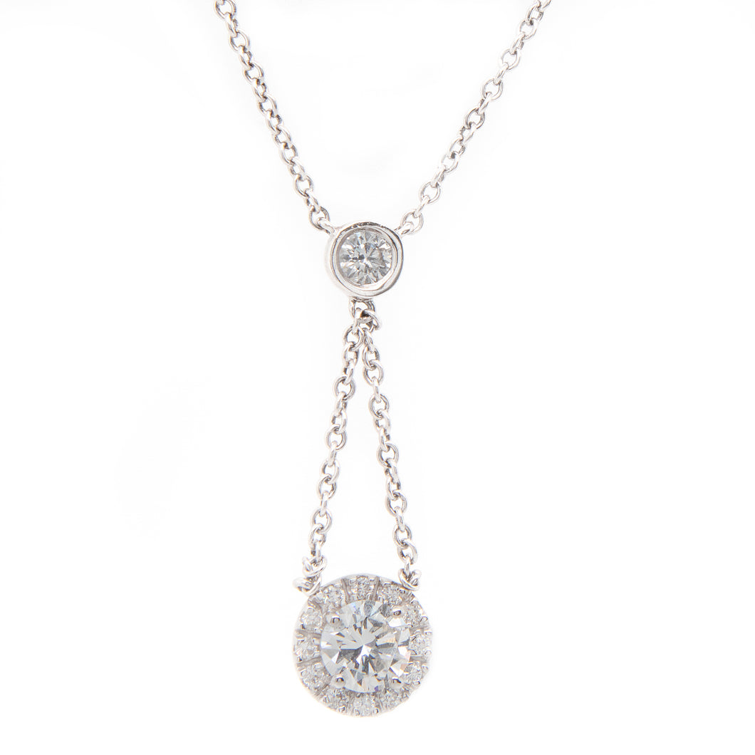 This gorgeous drop necklace features 14 round brilliant cut diamond...
