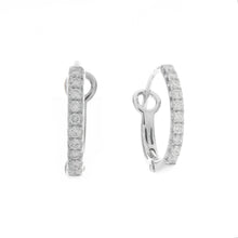 these small hoops feature pave set diamonds totaling .17ct. hoops a...