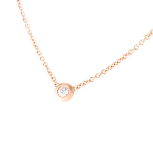 This simple and clean necklace features a mini bezel diamond on a r...
