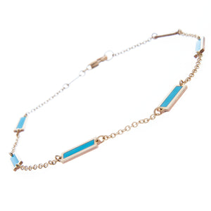 6 elegant turquoise inlays on a 14k yellow gold chain link bracelet.