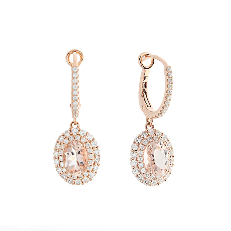 These earrings feature round brilliant cut diamonds that total .85c...