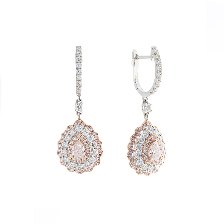 These earrings feature white round brilliant cut diamonds that tota...