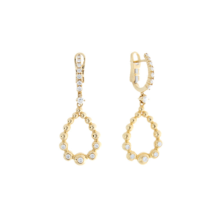 These earrings are in 18k yellow gold and feature pave set round br...