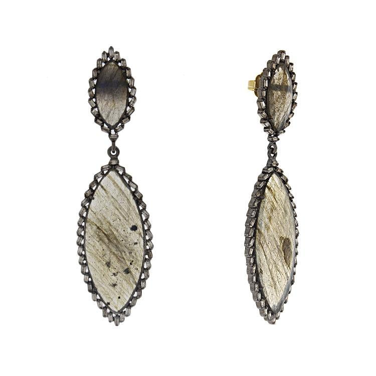 These earrings are in sterling silver with a black rhodium finish a...