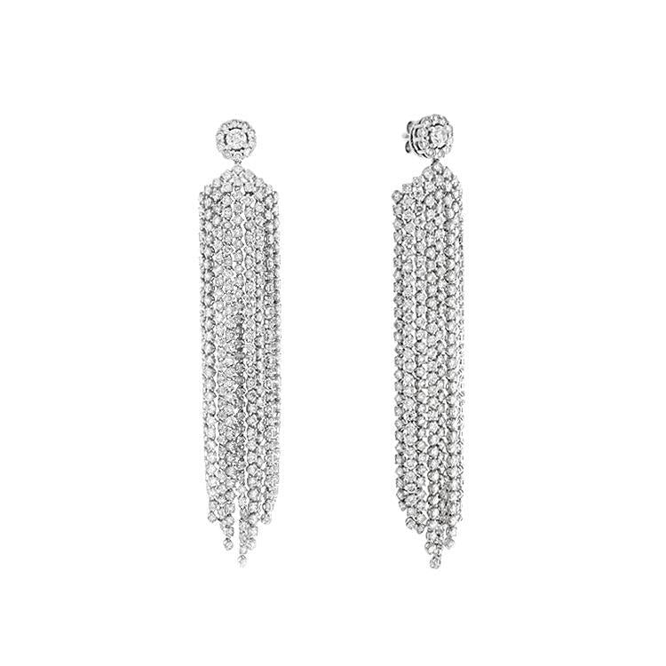 These earrings feature round brilliant cut diamonds that total 14.0...