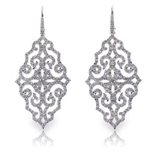 These unique earrings feature round brilliant cut diamonds that tot...