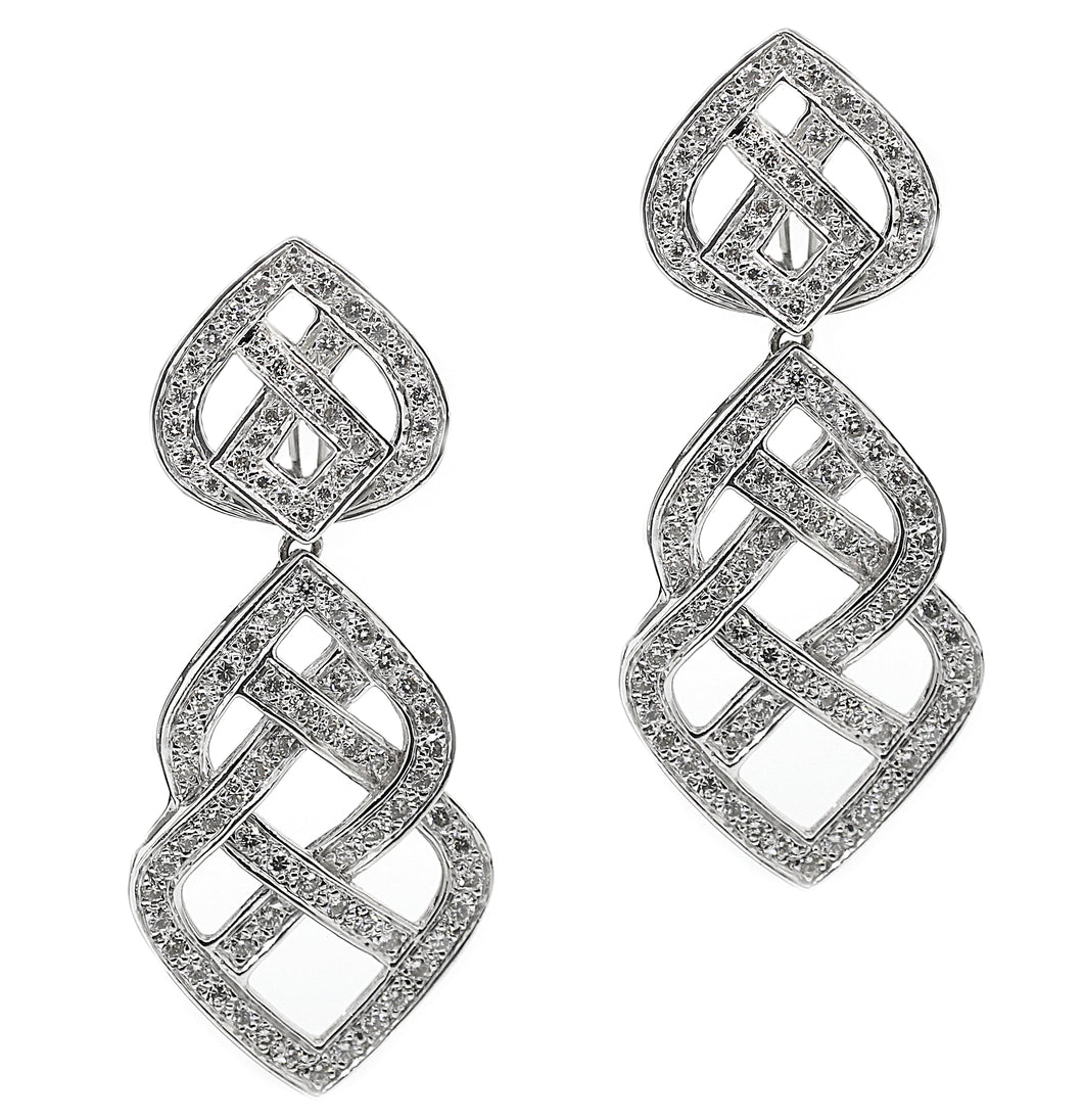 These 18k white gold estate earrings feature pave set round brillia...