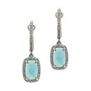 These earrings feature two blue topaz stones in the center with rou...