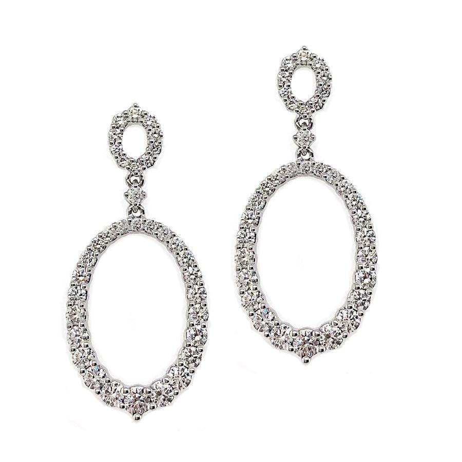 These earrings features round brilliant cut diamonds that total 2.0...