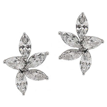 These earrings feature marquise diamonds that total 5.23cts.