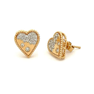 These minimalist stud earrings feature round brilliant cut diamonds...