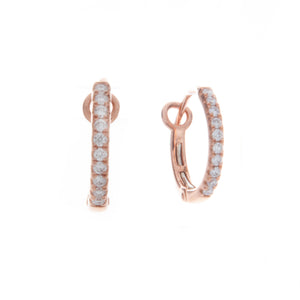 these small hoops feature pave set diamonds totaling .17ct. hoops a...