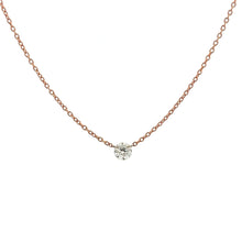 A modern and minimalist rose gold necklace with a diamond totaling ...